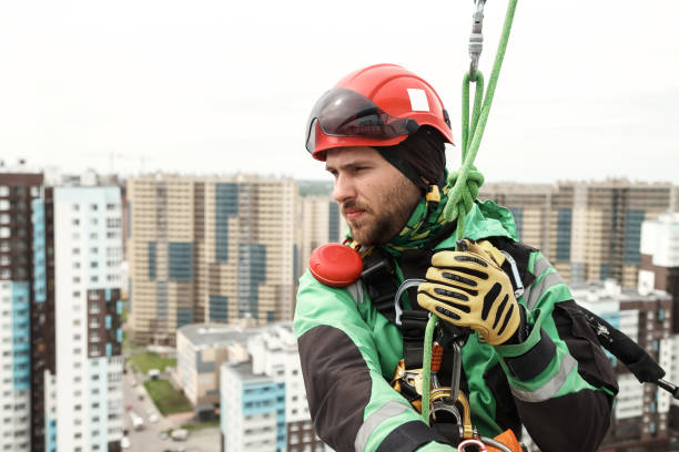 istock Industrial mountaineering worker during high rise work 1403478218