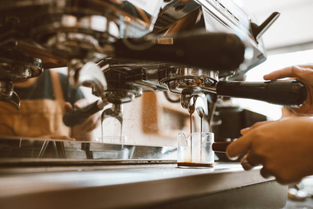 istock Selective focus barista making coffee with professional machine, Coffee pouring into a cup, small business, startup business. 1403478573