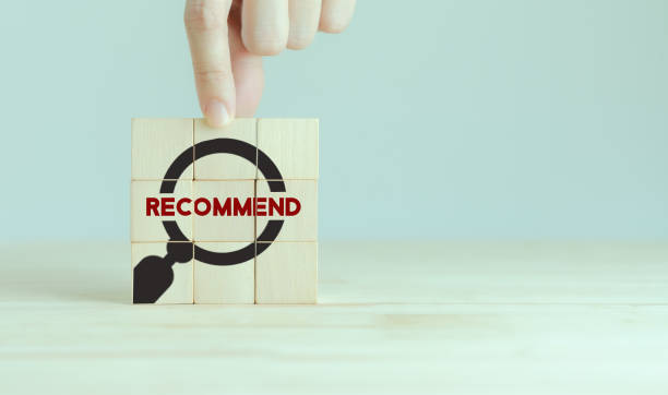 istock Recommendation concept. Expert opinion and experience sharing. Hand placed wooden cubes with 