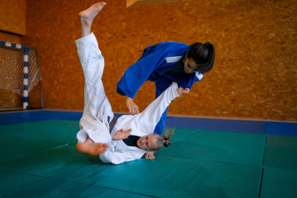istock Two young females practicing judo together 1403479590