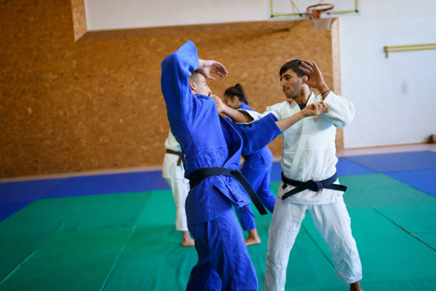 istock Sparing partners practicing judo in the gym 1403480328