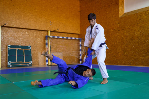 istock Two male judokas in a fight 1403480439