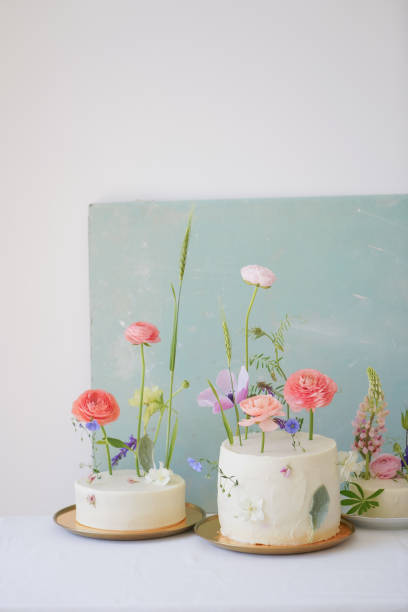 istock Perfect white cakes with white cream with floral decor 1403484632