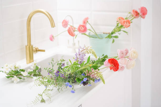 istock Beautiful white kitchen with flowers 1403484711