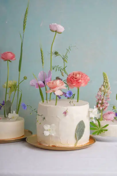 Luxury wedding cakes with original stylish modern decor on a vintage background