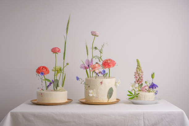 istock Wedding dessert. Three white cakes with white cream 1403484735