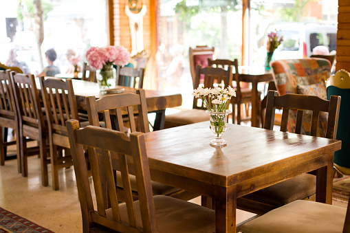 Cafe table with fresh flower decoration