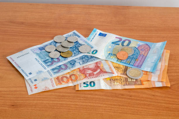 Croatian kuna coins and HRK hrvatska kuna (Croatian) banknotes and Euro banknotes and coins. stock photo