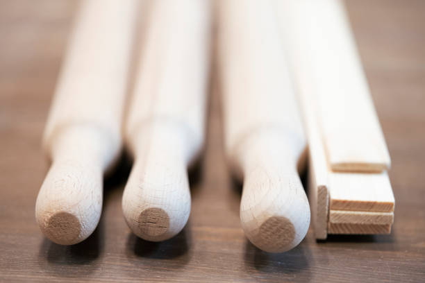 istock Wooden handicrafts. Rolling pins in a wooden box. 1403485151