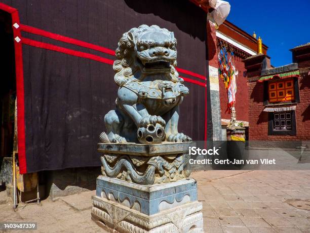 Lion At The Entrance Of The Sakya Monastery In Tibet Stock Photo - Download Image Now