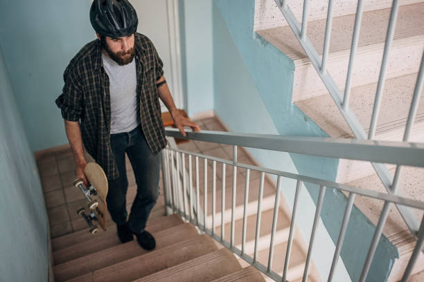 istock Skater walking up the steps 1403488648