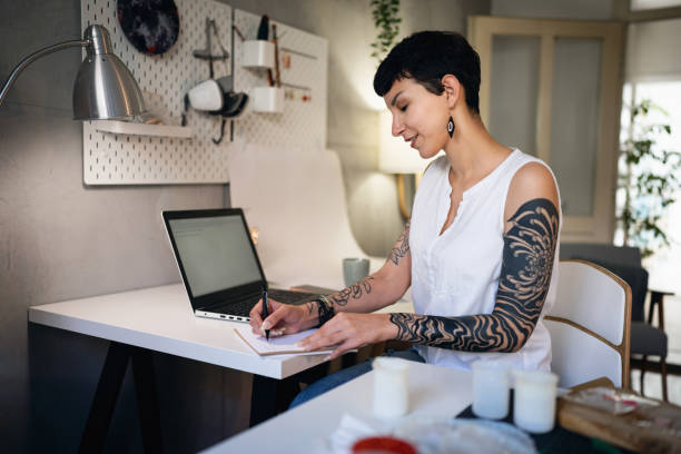 istock Female small business owner, working on laptop from studio 1403488717