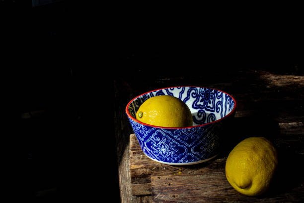istock a lemon in a bowl and one out 1403489184