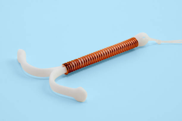 intrauterine device (IUD) T-shaped birth control device iud stock pictures, royalty-free photos & images