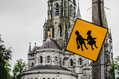 Children crossing sign in Cork, Ireland - Saint Fin Barre's Cathedral
