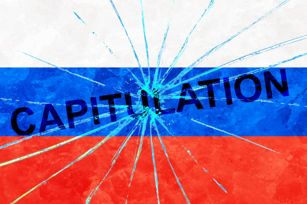 istock Russian flag on a broken glass texture with the inscription capitulation 1403493737