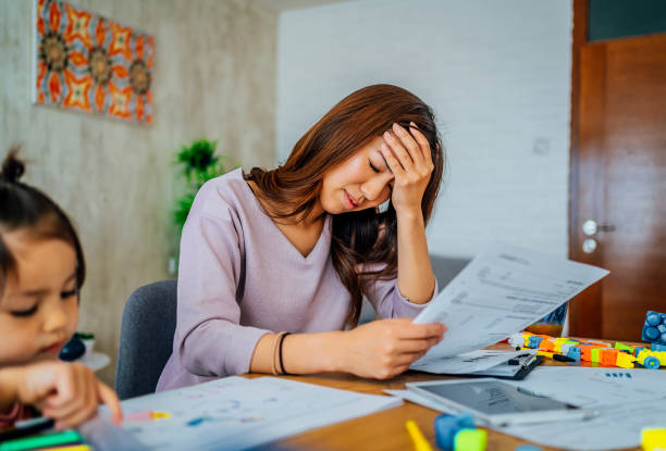 istock Worried mother going through her financials 1403495566