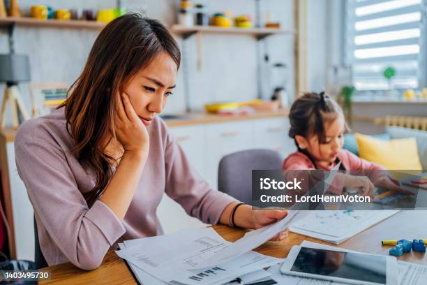 Stressed Mother Going Through Her Finances Stock Photo - Download Image Now - Finance, Financial Bill, Home Finances