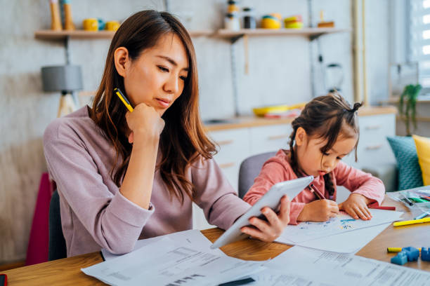 istock Mother checking and calculating her finances 1403496018