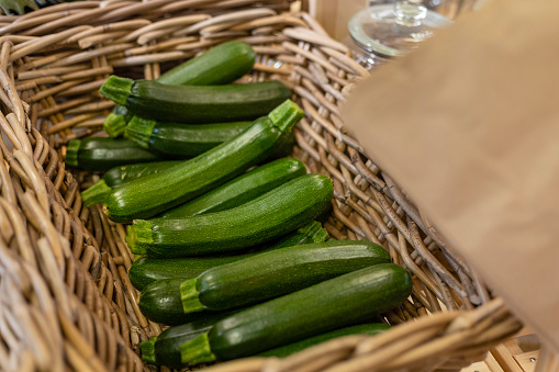 Courgette vegetables being sold loose without packaging in a store that promotes sustainable living in the North East of England. The store has refill stations to reduce plastic and food waste.