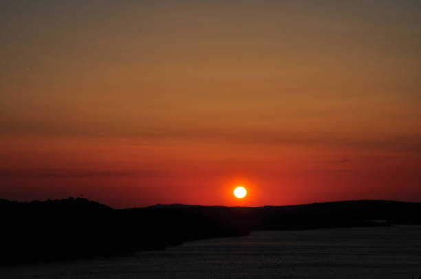 Sunset on sea. Bright sun on sky. beach landscape
