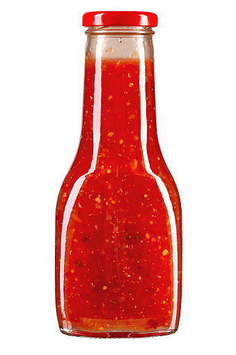 Fresh Ketchup. Barbecue sauce in a glass bottle isolated in white background. File contains clipping path.