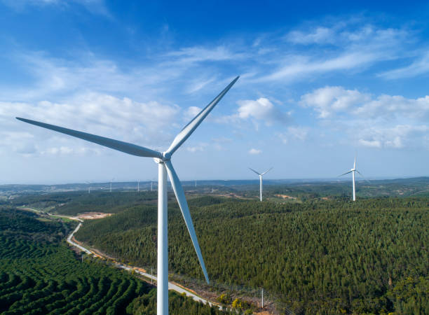 istock Windmills or wind turbine on wind farm 1403507208