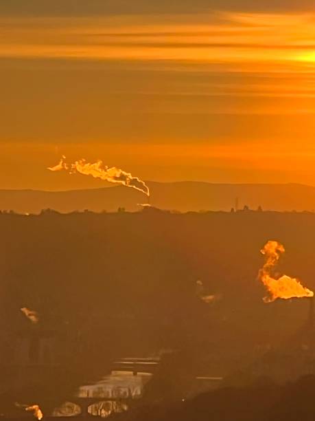 istock Smoking chimney at sunrise 1403507841