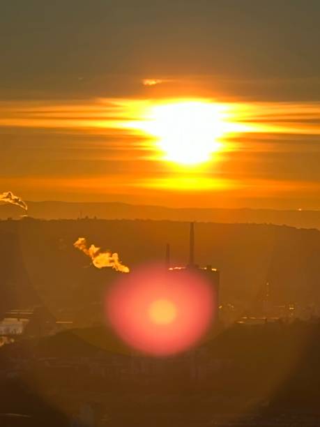 istock Smoking chimney at sunrise 1403507852