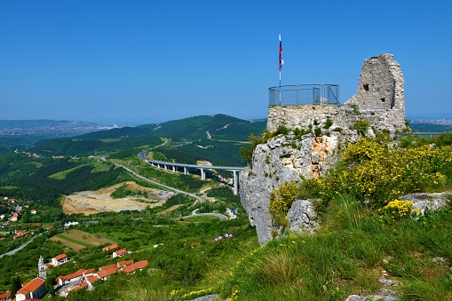 View of Crni Kal fortress at Karst Edge in Primorska, Slovenia and the viaduct on Primorska motorway