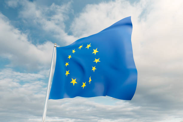 istock European Union flag against blue sky. 1403508288