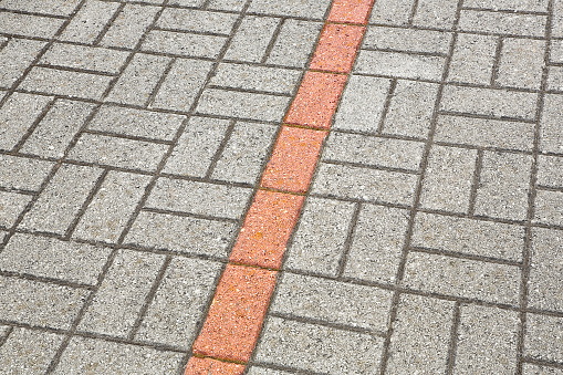 Concrete self locking flooring blockS assembled on a substrate of sand - type of flooring permeable to rain water as required by the building laws