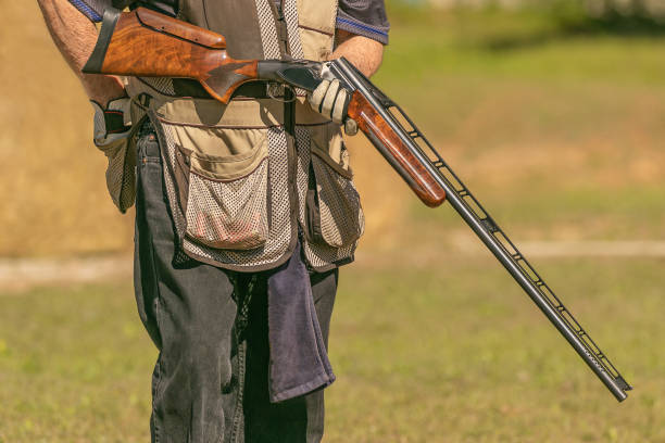 istock Man preparing his shotgun for skeet shooting 1403511093