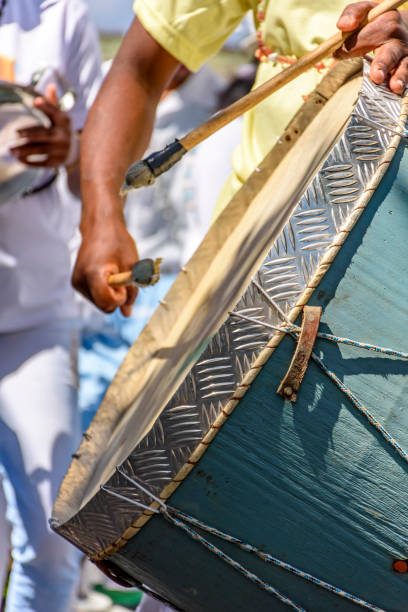 Drum player lit by the sun during Brazilian Carnival