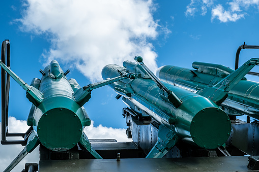 Multiple launch rocket system. Rockets are aimed at the sky. Day. Sunny.