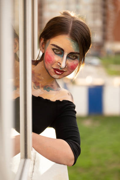 istock girl with drawn face 1403525410