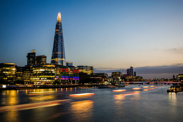 The city of London Dramatic sunset sky over the river Thames and the Shard of Glass rising over other modern steel and glass buildings. Photo taken on 10th of June 2022 in London, United Kingdom. night sky only stock pictures, royalty-free photos & images