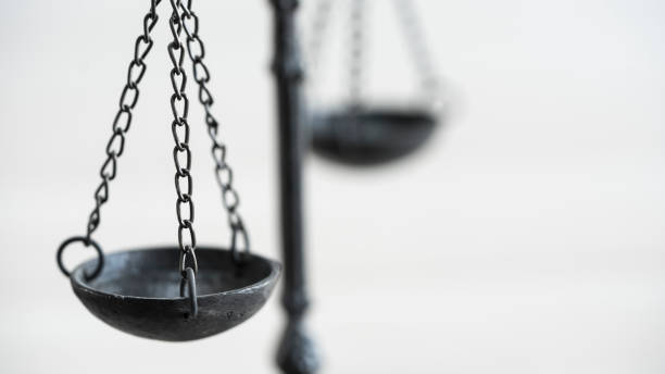istock Scales of justice on the isolated background 1403530253