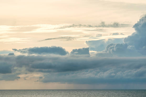 istock Beautiful tranquil sky with clouds during sunset over the sea 1403531631