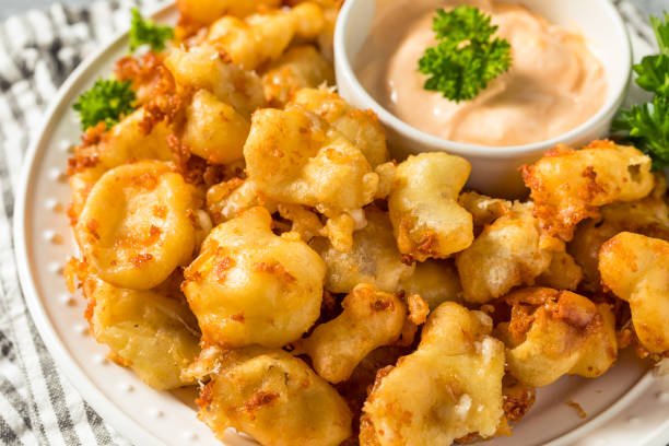 Homemade Deep Fried Wisconsin Cheese Curds Homemade Deep Fried Wisconsin Cheese Curds with Dipping Sauce curd cheese stock pictures, royalty-free photos & images