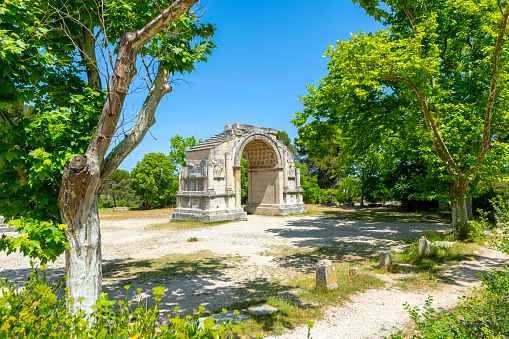 The ancient Roman triumphal arch at the historic Glanum archaeological site near Saint Remy in the Provence region of Southern France.