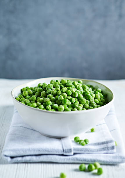 istock Frozen green pea in a bowl. Copy space 1403533813