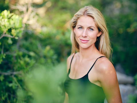 A woman enjoying active lifestyle time outdoors in a nature environment.