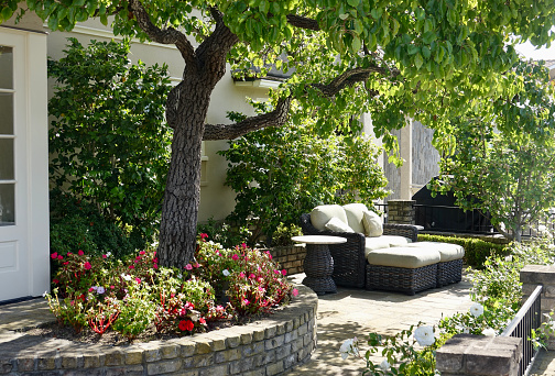 Garden terrace with outdoor furniture and pillows