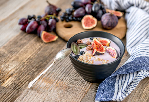 istock An useful dessert - yogurt, muesli and figs with grapes 1403537737