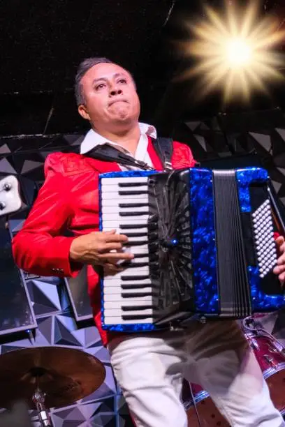 Hispanic accordionist performing in a concert