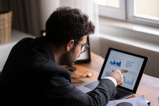 istock Man working on laptop at home 1403539740