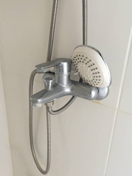 istock Bathtub faucet on the ceramics tile wall 1403547210