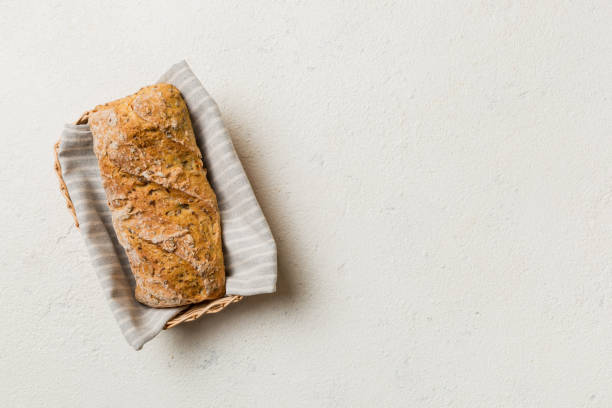 istock Freshly baked bread on basket against natural background. top view bread copy space 1403552533