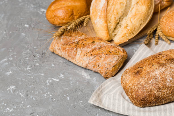 istock Homemade natural breads. Different kinds of fresh bread as background, perspective view with copy space 1403552548
